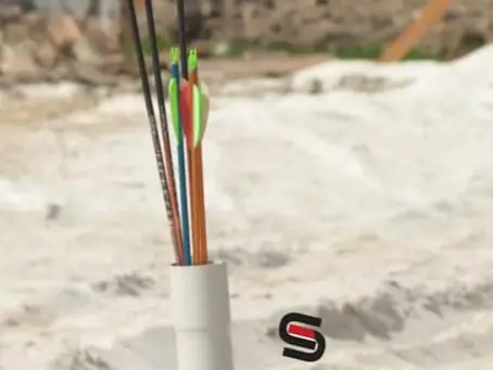 Quivers holding arrows in the sand