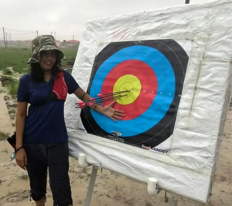 Archer pointing at a target face